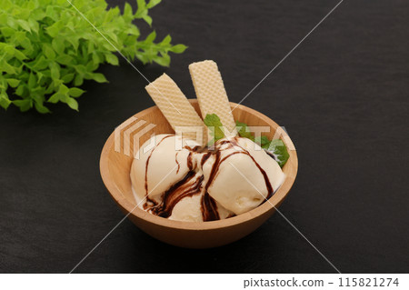 Vanilla ice cream with chocolate sauce 115821274