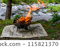 Bonfire on the riverbank, outdoors 115821370