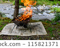 Bonfire on the riverbank, outdoors 115821371