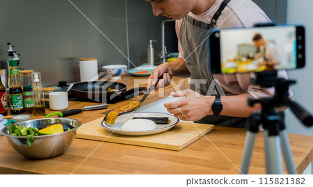 The chef is broadcasting live from workshop how to prepare a grilled eggplants with garlic The chef is broadcasting live from workshop how to prepare a grilled eggplants with garlic 115821382