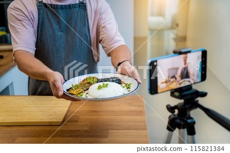 The chef is broadcasting live from workshop how to prepare a grilled eggplants with garlic The chef is broadcasting live from workshop how to prepare a grilled eggplants with garlic 115821384