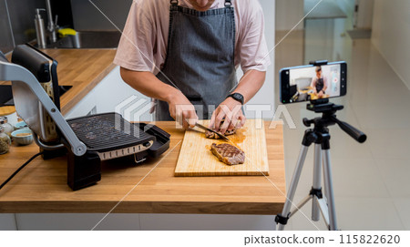 The chef is broadcasting live from workshop how to prepare a beef steaks on the electric grill The chef is broadcasting live from workshop how to prepare a beef steaks on the electric grill 115822620