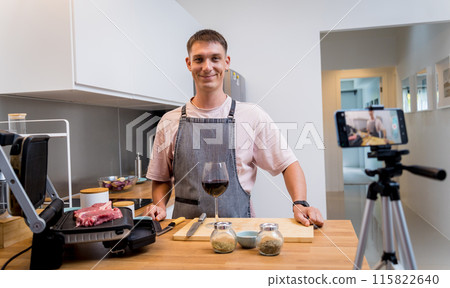 The chef is broadcasting live from workshop how to prepare a beef steaks on the electric grill The chef is broadcasting live from workshop how to prepare a beef steaks on the electric grill 115822640