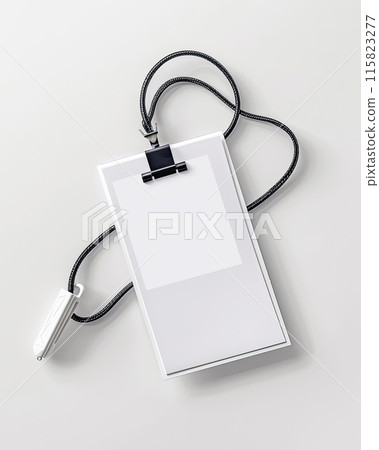 Simple yet elegant setup of a blank white identification badge attached to a stylish black and white lanyard, placed on a gray background.. 115823277