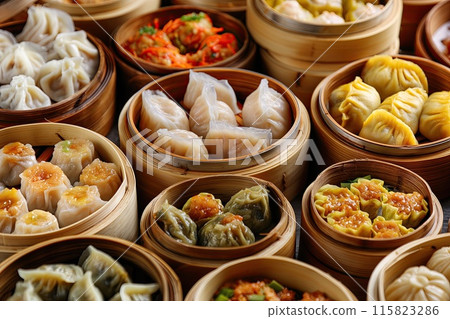 A delicious array of various Chinese dumplings presented in bamboo steamers, showcasing an appetizing selection of fillings and textures.. A delicious array of various Chinese dumplings presented in bamboo steamers, showcasing an appetizing selection of fillings and textures.. 115823286