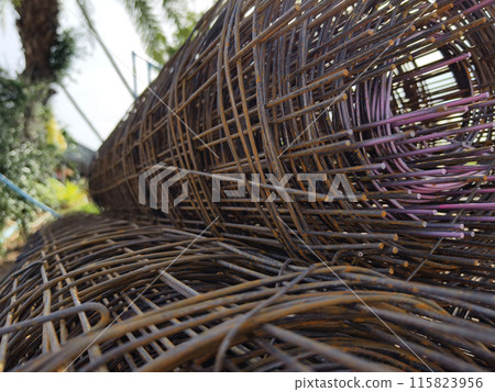 Metal bars arranged stack at the construction site Metal bars arranged stack at the construction site 115823956