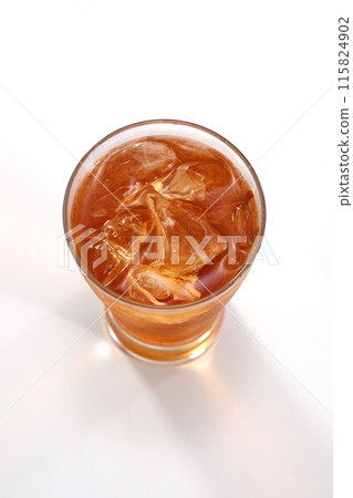 Iced tea poured into a glass Iced tea poured into a glass 115824902