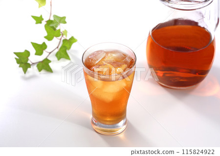 Iced tea poured into a glass Iced tea poured into a glass 115824922