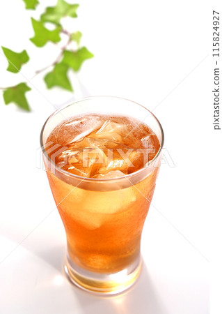 Iced tea poured into a glass 115824927
