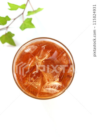 Iced tea poured into a glass 115824931