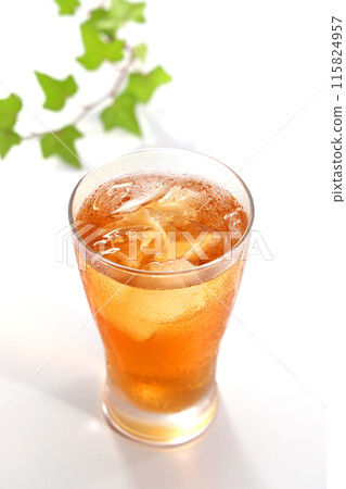 Iced tea poured into a glass 115824957