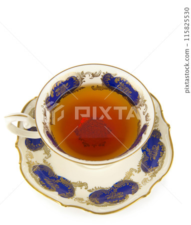 Tea in vintage porcelain cup isolated on white . Free space for text. 115825530