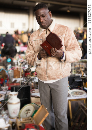South African chooses antiques at a flea market South African chooses antiques at a flea market 115827081