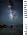 milky way over rocks 115827545