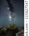 milky way over rocks 115827547