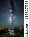 milky way over rocks 115827548