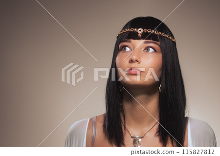 Cleopatra-Inspired Model With Surprised Expression and Traditional Jewelry Cleopatra-Inspired Model With Surprised Expression and Traditional Jewelry 115827812