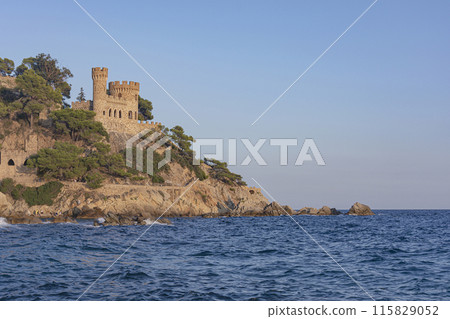 A fortress wall with a tower on a mountain on the seashore A fortress wall with a tower on a mountain on the seashore 115829052