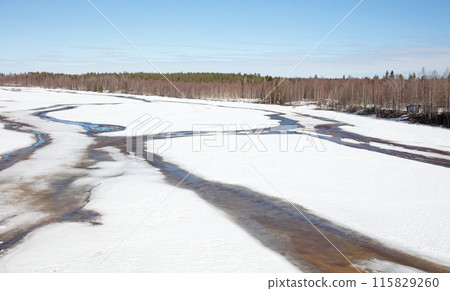 Frozen river in the north of Finland (Lapland) 115829260