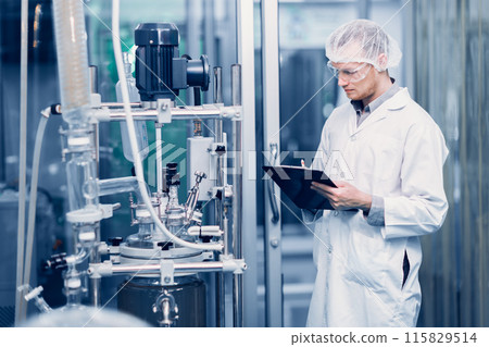 Scientist Medical Factory Staff Working in Science Lab. Medicine factory Technician Employee Check Care Products Quality in Sterilize Room Taking Note in Check list. 115829514