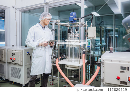 Scientist staff working with Equipment in Science Lab. Medical factory staff. Pharmaceutical Plants Process. 115829529
