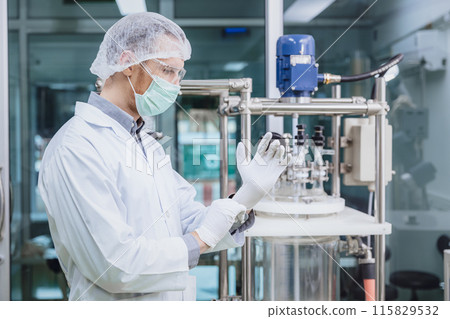 Scientist staff wearing Latex Medical Glove in Science Lab. Medical factory staff in clean room. Pharmaceutical Plants Process. Scientist staff wearing Latex Medical Glove in Science Lab. Medical factory staff in clean room. Pharmaceutical Plants Process. 115829532