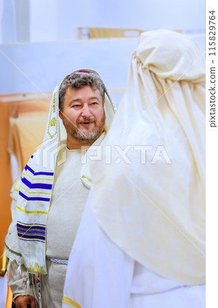 Rabbi at religious man Jewish traditional clothing is in synagogue during pray 115829764