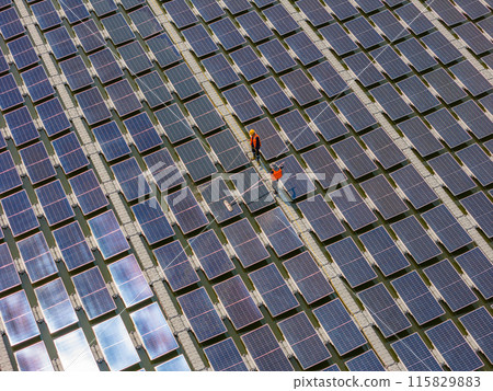 Worker Cleaning floating solar panels or solar cell Platform system on the lake Worker Cleaning floating solar panels or solar cell Platform system on the lake 115829883