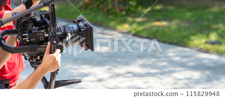 Movie shooting or video production and film crew team with camera equipment. Movie shooting or video production and film crew team with camera equipment. 115829948