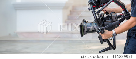 Movie shooting or video production and film crew team with camera equipment. Movie shooting or video production and film crew team with camera equipment. 115829951