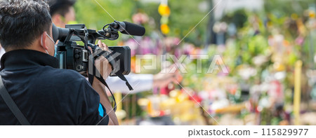 Movie shooting or video production and film crew team with camera equipment. 115829977