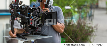 Movie shooting or video production and film crew team with camera equipment. Movie shooting or video production and film crew team with camera equipment. 115829979