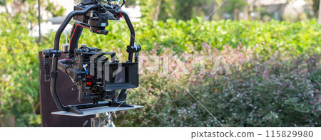 Movie shooting or video production and film crew team with camera equipment. Movie shooting or video production and film crew team with camera equipment. 115829980