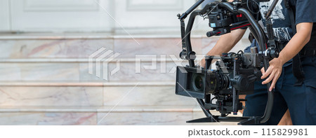 Movie shooting or video production and film crew team with camera equipment. Movie shooting or video production and film crew team with camera equipment. 115829981