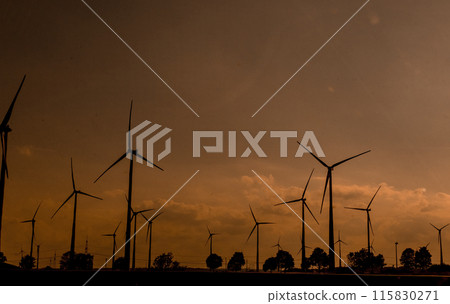 farm electric windmills energy field night sunset 115830271