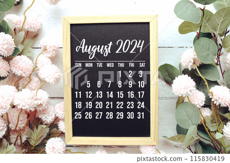 August 2024 monthly calendar with flower bouquet decoration on wooden background 115830419