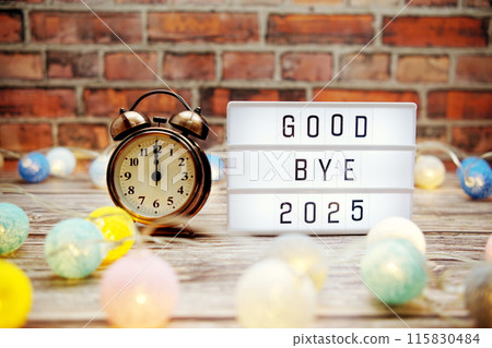 Goodbye 2025 text in light box with alarm clock and LED cotton balls decoration Goodbye 2025 text in light box with alarm clock and LED cotton balls decoration 115830484