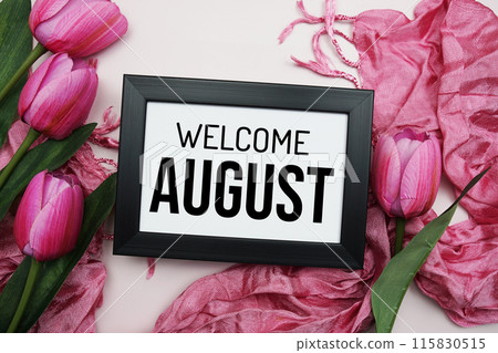 Welcome August text message with pink tulip flower on pink background 115830515