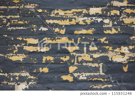 Old black brick wall with peeling paint Old black brick wall with peeling paint 115831246