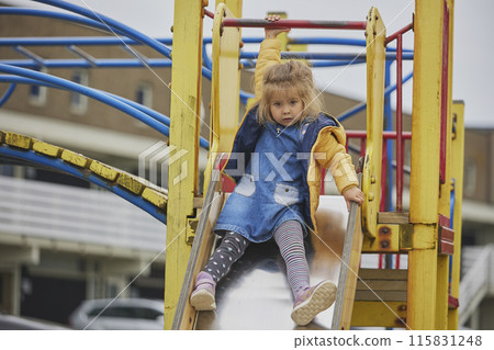 Charming child playing on a playground in Ringkobing Denmark 115831248