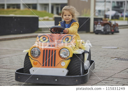 cute child playing in an amusement park in Denmark cute child playing in an amusement park in Denmark 115831249
