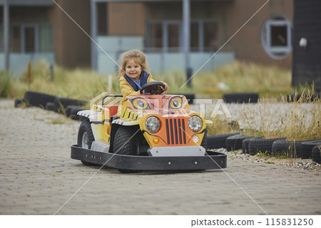 cute child playing in an amusement park in Denmark cute child playing in an amusement park in Denmark 115831250