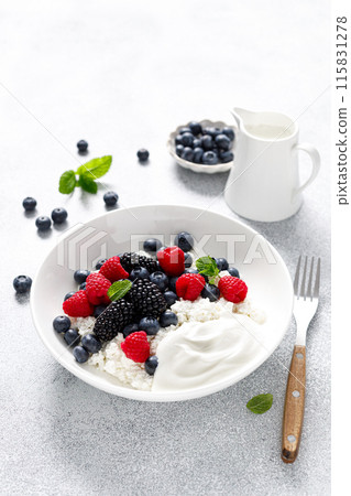 Cheese cottage with yogurt and fresh berries. Curd with blueberry, raspberry and blackberry 115831278
