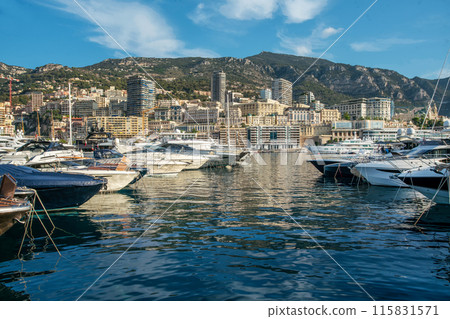 Awe Morning view on boats and yachts (sailboats) in Hercule port and buildings of Monaco and Monte Carlo in right direction with Awe Morning view on boats and yachts (sailboats) in Hercule port and buildings of Monaco and Monte Carlo in right direction with 115831571