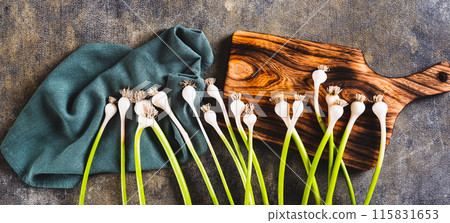 New trendy vegetable sweet garleek on cloth and cutting board top view web banner 115831653