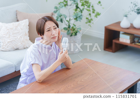 Women who use a handy fan 115831701