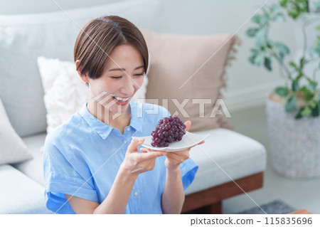 Woman eating grapes (summer, food, fruit) Woman eating grapes (summer, food, fruit) 115835696