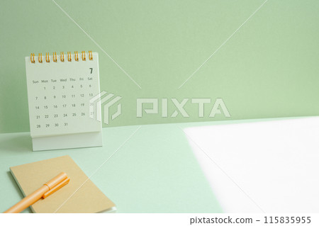 Calendar and notepad, pen for schedule, business, vacation plan on mint green desk background Calendar and notepad, pen for schedule, business, vacation plan on mint green desk background 115835955
