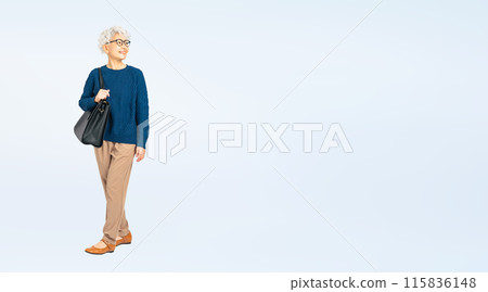Full body photo of a senior woman walking with a bag Full body photo of a senior woman walking with a bag 115836148