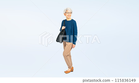 Full body photo of a senior woman walking with a bag 115836149